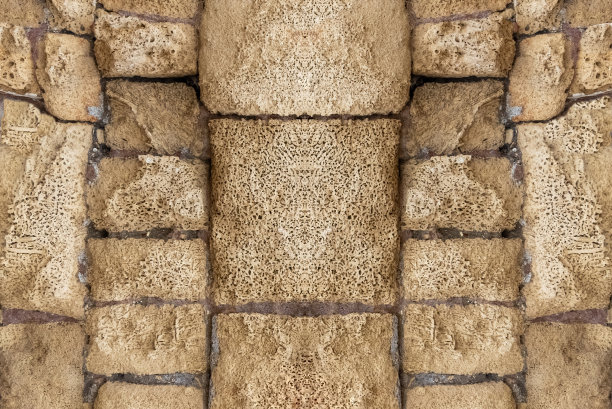 破旧的建筑立面与旧的破损表面。Grunge石墙背景。库存图片图片下载