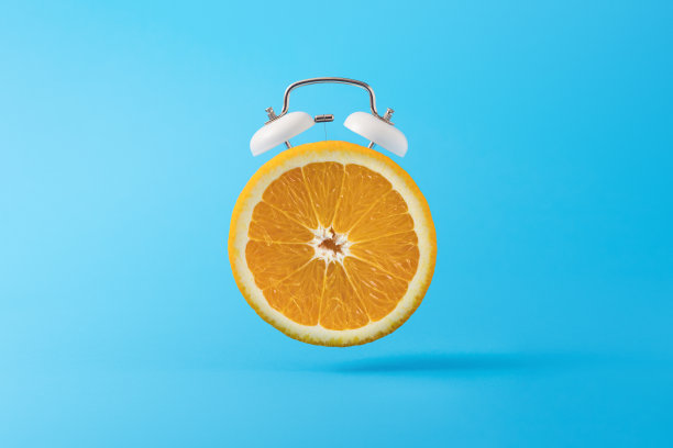 最小的概念背景与橙色闹钟背景图片下载