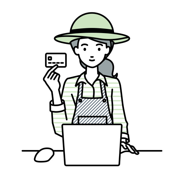 一位农妇在她的办公桌前使用笔记本电脑，手里拿着一张信用卡图片下载