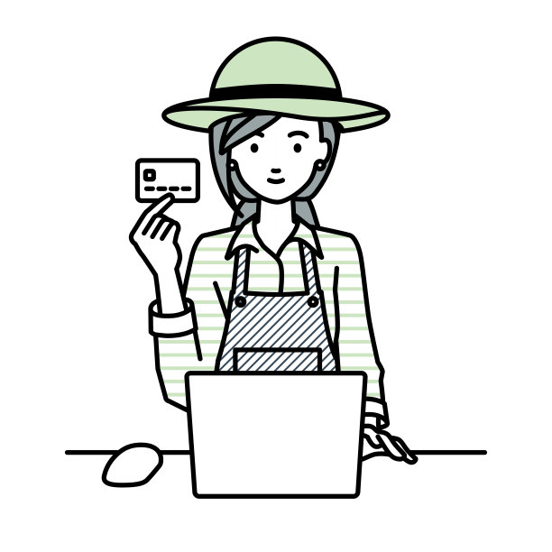 一位农妇在她的办公桌前使用笔记本电脑，手里拿着一张信用卡图片下载