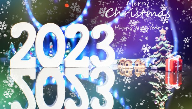 圣诞快乐和新年快乐的文字设计在神奇的蓝色散焦散焦光。闪闪发光的节日背景圣诞卡图片下载