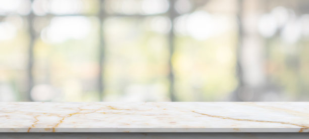 大理石桌面与模糊的厨房咖啡馆餐厅内部背景图片下载