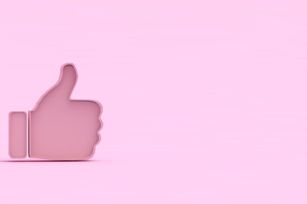 在粉色背景上竖起大拇指图片下载