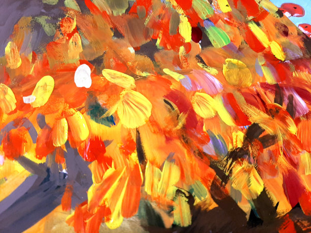 在刷子底座上涂抹五颜六色的油漆污渍。黄色、红色、橙色图片下载