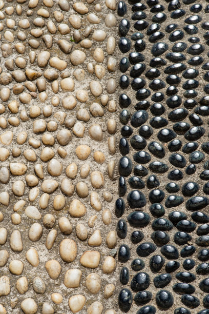 地面上黑白石头的特写，背景图片下载