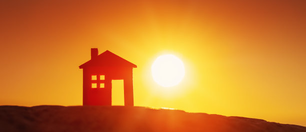 日落之夜，房子的模型立在地上。图片下载