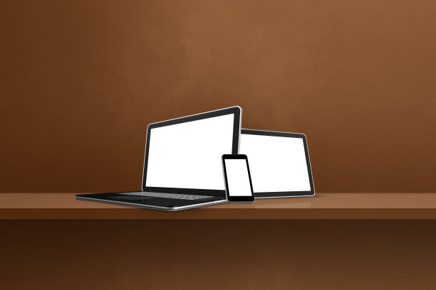 笔记本电脑，移动电话和数字平板电脑在棕色的墙架子上。水平的背景图片下载