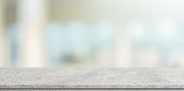 抽象模糊的当代室内客厅背景与白色水泥桌进行展示，推广和设计内容或产品的展示理念图片下载