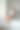 穿着白t恤和牛仔短裤的年轻漂亮女子早上在厨房里喝热咖啡。图片下载