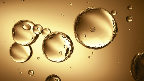 黄色背景中漂浮着透明的气泡图片下载