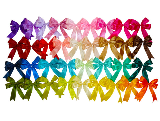 堆叠彩色手工丝带在白色背景的礼物包装和头发装饰。图片下载