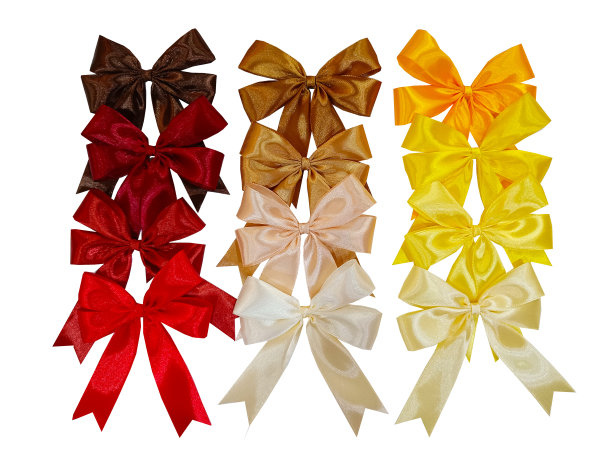 红色和棕色的蝴蝶结和缎带孤立在白色背景的礼物装饰。图片下载