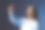 年轻的女企业家在灰色的工作室背景下触摸虚拟屏幕图片下载