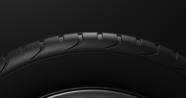 汽车边缘接近侧面的看法在一个黑色的背景。汽车轮胎宏。汽车轮。三维渲染图片下载
