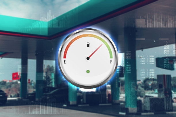 装有汽车油表的加油站。在模糊中重新填充绿色。模糊的照片作为背景。图片下载