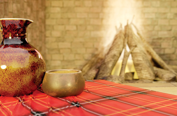 一个茶水壶和一个壶的背景是一个舒适的离焦壁炉在一个寒假的乡村别墅复制空间。3 d演示。图片下载