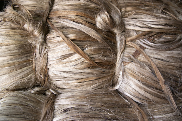 一束厚厚的金色黄麻纤维质地背景图片下载