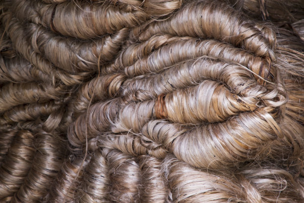 一束厚厚的金色黄麻纤维质地背景图片下载