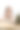 美丽的亚洲穆斯林妇女戴着头巾，一边喝咖啡一边在办公桌前工作。图片下载