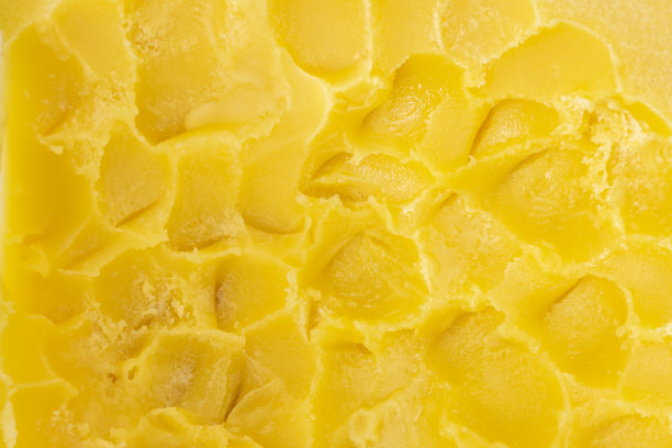 有质感的表面，厚厚的黄色巴西蜂蜜团。背景。图片下载