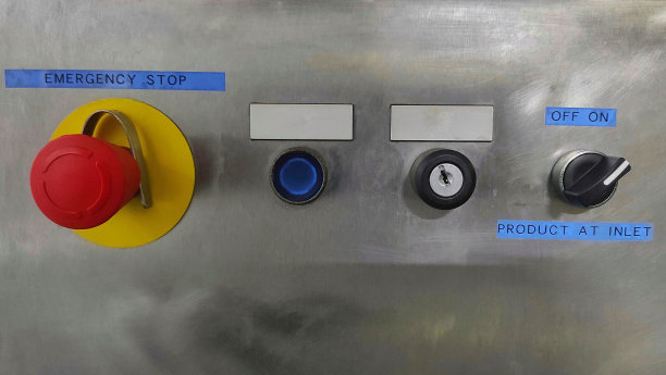 工业机器的控制面板，有按钮，钥匙孔，开关和紧急停止图片下载