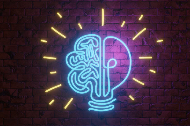 霓虹灯发光管弯曲成灯泡和大脑的形状，放在红砖墙上。说明概念的想法和创造力图片下载