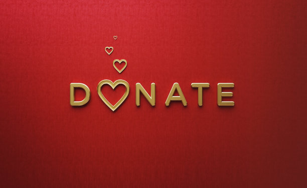 金色的心形和捐字在红色的背景图片下载
