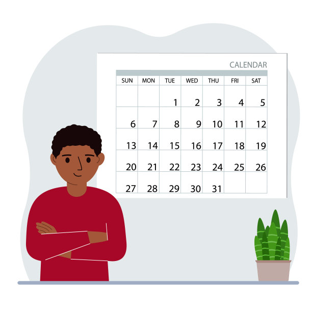 小男孩靠近大日历。为这个月、学习、假期、周末和重要的约会做计划。图片下载