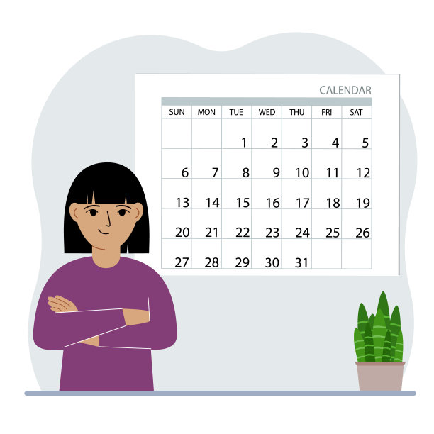 小女孩靠近大日历。为这个月、学习、假期、周末和重要的约会做计划。图片下载