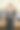 年轻而成功的商业女性的肖像。在现代化的办公室里和同事开会时，快乐聪明的女孩穿着商务套装图片下载