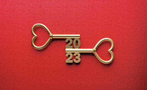 2023字用金色钥匙写在红色背景上图片下载