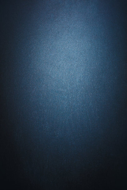 抽象的现代暗质感墙面背景被灯光照亮。图片下载