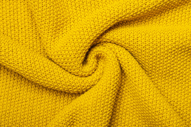 亮黄色微距照片的纹理球衣和针织毛衣或运动衫。图案和背景为时尚暖秋概念图片下载
