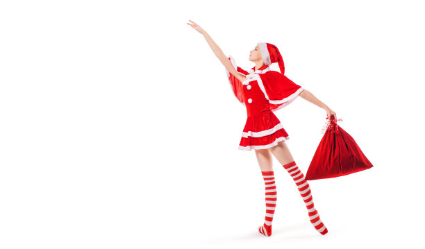 跳舞的芭蕾舞女演员手里拿着一袋礼物，脚上穿着白色背景的圣诞老人服装。图片下载