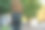一个年轻人骑着电动摩托车穿过公园图片下载