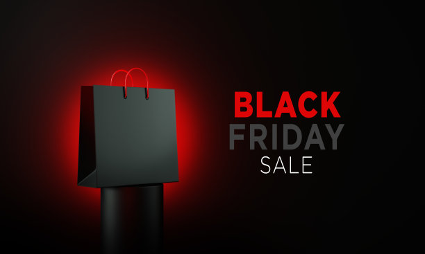 黑色星期五写黑色购物袋坐在黑色讲台前的黑色背景图片下载