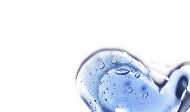 美容精华液的凝胶质地。透明的气泡背景护肤霜。透明彩色化妆品特写图片下载