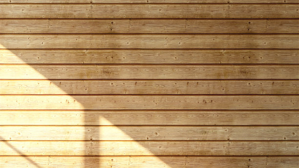 美丽柔和的阳光和阴影从窗户上的空木板墙背景图片下载