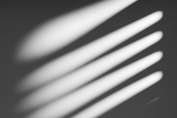 抽象的混凝土立面与阳光阴影背景。图片下载