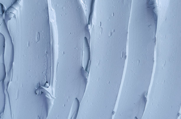 灰色、蓝色膨润土面泥(藻酸盐面膜、面霜、身体包裹)质地贴近，选择性聚焦。抽象的背景与笔触。图片下载