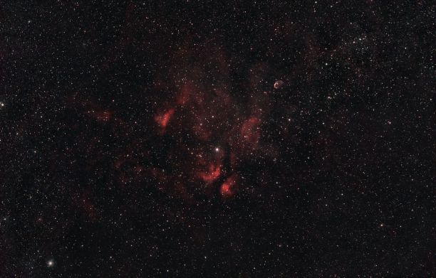 美丽的红色星云，拥有数十亿颗恒星。图片下载