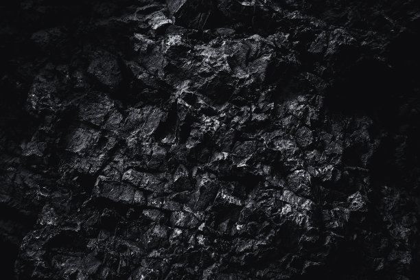 黑色的纹理。石头的背景。黑暗的大理石。岩石纹理。岩石表面有裂缝。岩石堆。墙漆点。枯燥乏味的粗糙结构。抽象的纹理。图片下载