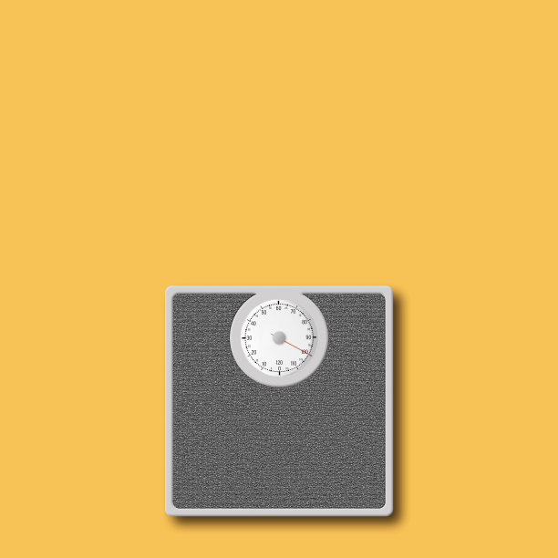 黄色背景上的鳞片。减肥的概念。副本的空间。运动。图片下载