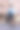 垂直肖像一个自信的年轻商业女性手里拿着公文包站在前景看着相机，领导的概念图片下载