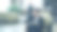 潘镜头英俊的大胡子商人坐在扶手椅上用记事本打电话，而商人女士带着行李从前台穿过酒店大堂图片下载