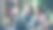 在现代化的办公环境中，年轻的企业家们正坐在办公桌前用智能手机聊天、自拍。他们摆着姿势，笑着图片下载