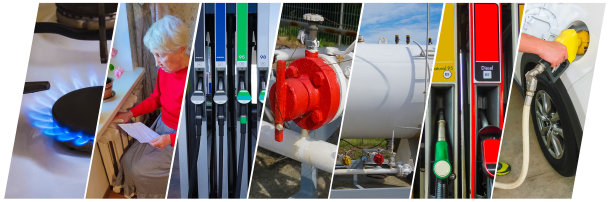 拿着煤气单站在暖气片前的老年妇女。冬天取暖费。图片下载