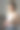 一位女士站在办公室里喝奶昔，用手机图片下载