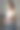 一位女士站在办公室里喝奶昔，用手机图片下载