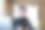 一名亚洲少女的肖像，戴着眼镜，使用笔记本电脑，耳机，并使用笔记本电脑通过视频会议在图书馆的木桌子上在线学习图片下载